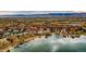Panoramic aerial shot showcasing a waterfront community, with docks, and distant mountains at 6790 W Crestline Ave, Littleton, CO 80123