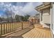 Inviting wooden back deck perfect for entertaining or relaxing with a view of the yard at 6790 W Crestline Ave, Littleton, CO 80123