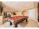 Basement area with billiards table and other game options at 6790 W Crestline Ave, Littleton, CO 80123