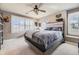 Bedroom with modern decor, a window seat, and shuttered windows at 6790 W Crestline Ave, Littleton, CO 80123