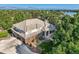 Beautiful home with brick and stucco exterior, manicured landscaping, and a view of the lake at 6790 W Crestline Ave, Littleton, CO 80123