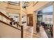 Grand foyer with a soaring ceiling, hardwood floors, and an elegant staircase leading to the upper level at 6790 W Crestline Ave, Littleton, CO 80123