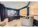 Comfortable home office featuring a custom desk, plush seating, and natural light from a large window at 6790 W Crestline Ave, Littleton, CO 80123