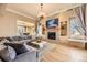 Inviting living room with a stone fireplace, built-in shelving, and comfortable seating at 6790 W Crestline Ave, Littleton, CO 80123