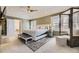 Spacious main bedroom features a ceiling fan, and plenty of natural light at 6790 W Crestline Ave, Littleton, CO 80123