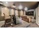 Home theater with projector, large screen, comfortable seating, and a bar area at 6790 W Crestline Ave, Littleton, CO 80123
