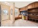 Functional mud room boasts built-in storage, bench seating, and natural light at 6790 W Crestline Ave, Littleton, CO 80123