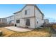 Exterior view of home showcasing backyard with patio area and fenced yard with grass at 9248 Salida St, Commerce City, CO 80022