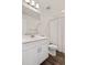 The bathroom includes a white vanity, mirror, and shower with curtain at 9248 Salida St, Commerce City, CO 80022
