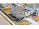 A charming two-story home featuring a covered porch, stone accents, and a well-manicured lawn at 9248 Salida St, Commerce City, CO 80022