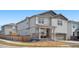 Charming two-story home with gray siding, a covered front porch, and a well-maintained yard at 9248 Salida St, Commerce City, CO 80022