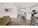 Bright living room showcasing modern decor, hardwood floors, and an open layout that connects to the kitchen at 9248 Salida St, Commerce City, CO 80022