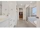 The main bathroom features dual sinks, quartz countertops, and a glass enclosed shower at 9248 Salida St, Commerce City, CO 80022