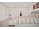 This main bedroom features neutral walls, carpet and a door leading to the main bathroom at 9248 Salida St, Commerce City, CO 80022