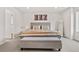 The main bedroom includes neutral walls, carpet and large bench seat at 9248 Salida St, Commerce City, CO 80022