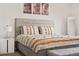 The main bedroom includes neutral walls, carpet and a decorative headboard at 9248 Salida St, Commerce City, CO 80022