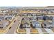 A neighborhood aerial view showcasing similar homes with well-maintained lawns and streets at 9248 Salida St, Commerce City, CO 80022