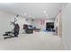 Finished basement provides entertainment space with sports memorabilia and an exercise area at 4323 W Ponds Cir, Littleton, CO 80123