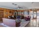 Inviting lobby area with comfortable seating, wood paneling, and decorative accents at 4323 W Ponds Cir, Littleton, CO 80123