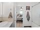 Bathroom view leading to a bright bedroom with modern decor at 3052 S Logan St, Englewood, CO 80113