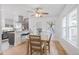 Cozy dining area adjacent to the kitchen with a ceiling fan at 3052 S Logan St, Englewood, CO 80113