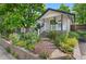 Charming home with a well-manicured yard and inviting front porch at 3052 S Logan St, Englewood, CO 80113