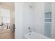 Bathroom showcases a soaking tub, shower with a seat, and blue-tiled recessed shelves at 5145 S Kearney Ct, Greenwood Village, CO 80111