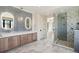 Bathroom features double sink vanity, stone counters, and glass-enclosed shower at 5145 S Kearney Ct, Greenwood Village, CO 80111