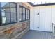 Exterior detail features modern wood and siding plus black-trimmed windows at 5145 S Kearney Ct, Greenwood Village, CO 80111