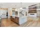 Spacious kitchen with a large island, modern appliances, and hardwood flooring at 5145 S Kearney Ct, Greenwood Village, CO 80111