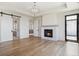 Spacious main bedroom boasts fireplace, barn door to bath, and access to the balcony at 5145 S Kearney Ct, Greenwood Village, CO 80111