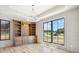 Well lit home office with built-in shelving, cabinets, hardwood floors and a large window with backyard views at 5145 S Kearney Ct, Greenwood Village, CO 80111