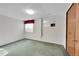 Unfinished basement room with window and closet at 5621 Demott Ave, Commerce City, CO 80022