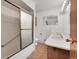 Clean bathroom with double vanity and shower/tub combo at 5621 Demott Ave, Commerce City, CO 80022