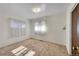 Simple bedroom with neutral carpeting and window coverings at 5621 Demott Ave, Commerce City, CO 80022