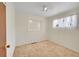 Bright bedroom with neutral walls and carpet, featuring a window seat at 5621 Demott Ave, Commerce City, CO 80022