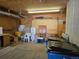 Oversized garage with cabinets and storage at 5621 Demott Ave, Commerce City, CO 80022
