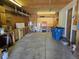 Garage with cabinets, shelving and storage at 5621 Demott Ave, Commerce City, CO 80022