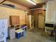 Large garage with shelving and storage at 5621 Demott Ave, Commerce City, CO 80022
