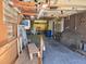 Spacious garage with ample storage shelving and space for workshop at 5621 Demott Ave, Commerce City, CO 80022