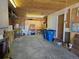 Garage with workbenches and ample storage at 5621 Demott Ave, Commerce City, CO 80022