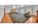 Spacious living room with hardwood floors, fireplace and patio access at 5621 Demott Ave, Commerce City, CO 80022