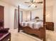 Main bedroom with a canopy bed, carpeted floors, and natural light at 9736 W Cornell Pl, Lakewood, CO 80227