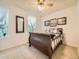 Bedroom showcasing a bed, bright natural light from the window, and neutral-toned walls at 9736 W Cornell Pl, Lakewood, CO 80227