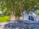 Inviting townhomes with garages and charming entry stairs, shaded by a mature tree at 9736 W Cornell Pl, Lakewood, CO 80227