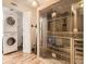 Indoor sauna beside laundry with wood paneling and a glass door, creating a spa-like ambiance at 9736 W Cornell Pl, Lakewood, CO 80227