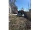 Fenced backyard with debris and some vegetation at 1165 S Winona Ct, Denver, CO 80219