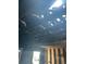 Ceiling with charred wooden beams, evidence of fire damage, and limited visibility to the exterior at 1165 S Winona Ct, Denver, CO 80219