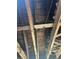 Exposed ceiling beams with remnants of insulation and signs of significant damage at 1165 S Winona Ct, Denver, CO 80219