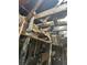 Heavily damaged ceiling with exposed beams and charred wood, showing severe structural damage at 1165 S Winona Ct, Denver, CO 80219